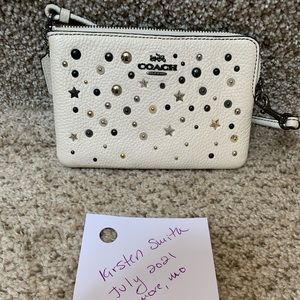 COACH SMALL WRISTLET CHALK WITH STAR RIVETS